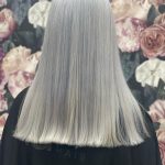 back of head with light grey straight hair at Glamaholic Salon